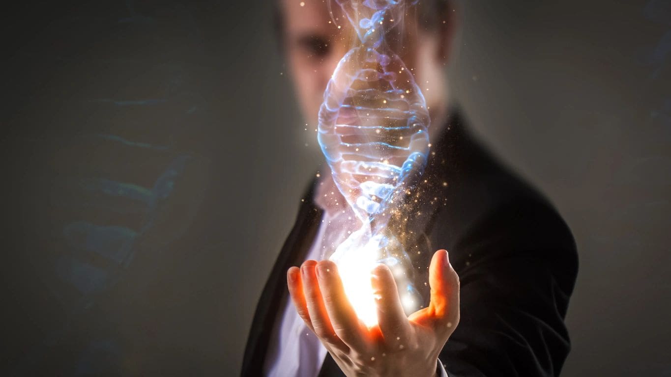 Man holding glowing DNA helix, digital concept.