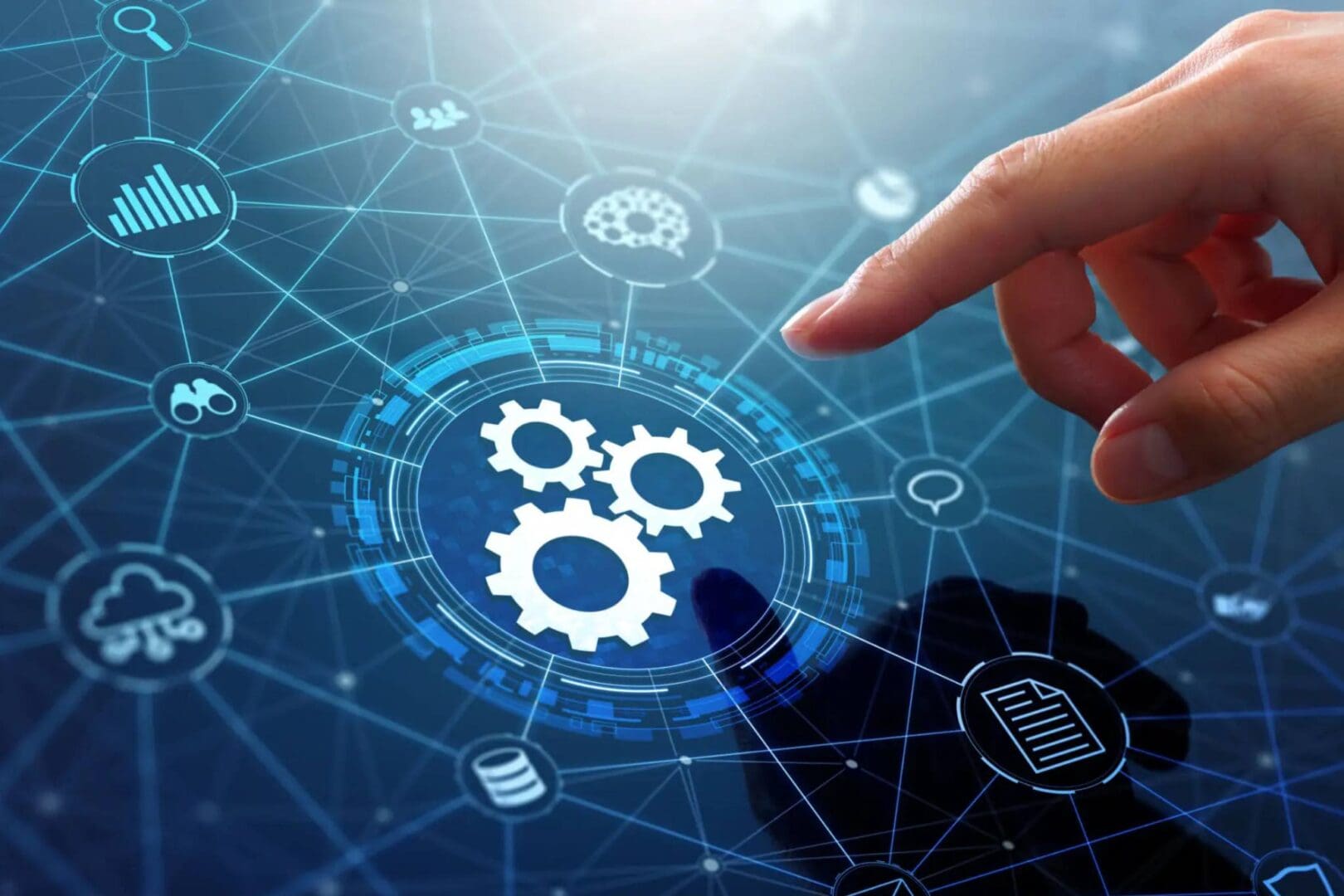 Hand interacting with digital gears and technology icons on a virtual interface.